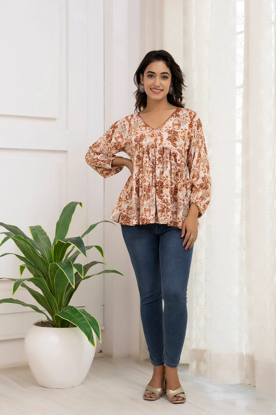 Women Rust Printed Peplum Tunic